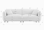 A lovable, fat, bread-like sofa with 2 pillows and metal feet with anti-skid pads